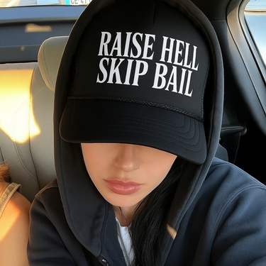 "RAISE HELL SKIP BAIL' FOAM BLACK TRUCKER