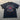 Black t-shirt with 'Melbourne Bitter' logo on a gray surface